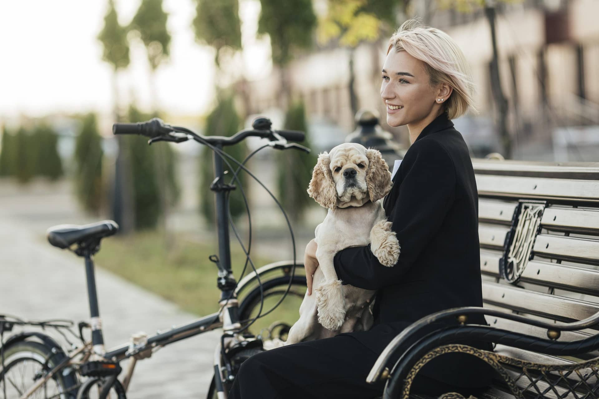 Pretty woman petting her cute dog